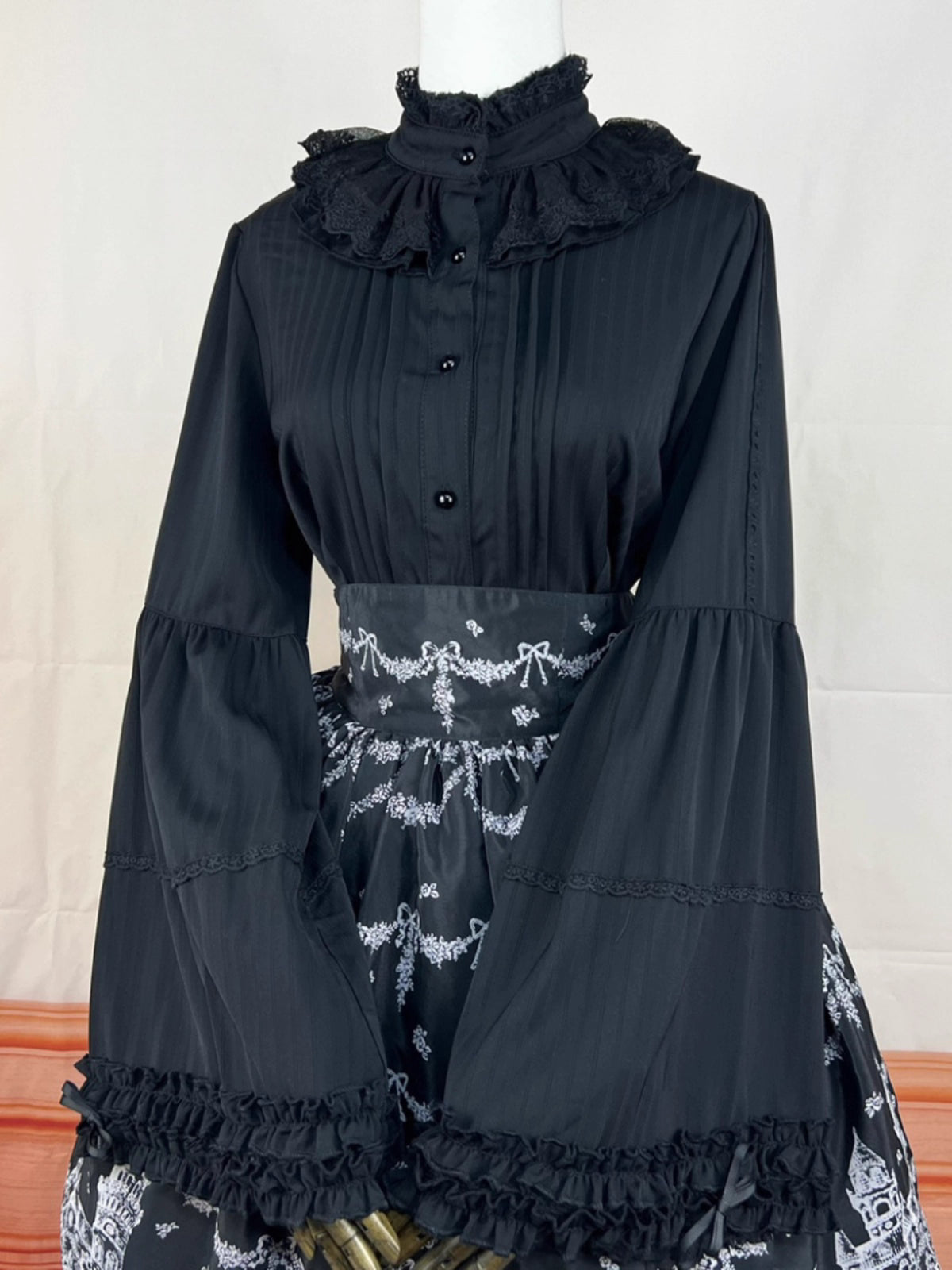 Design Concept:
This Lolita blouse features a stand collar and elegant princess sleeves, crafted in a Gothic punk style for a bold, edgy look. The long sleeves and slim-fit design make it ideal as an inner layer or statement top, adding a sophisticated yet daring touch to any Lolita ensemble. Available in Black, it complements a variety of Gothic and punk-inspired outfits.