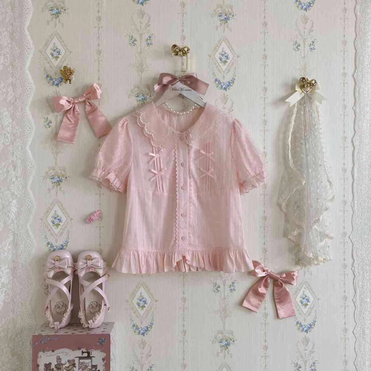 Design Concept:
This sweet Lolita blouse is designed with a short-sleeve cut and adorned with a delicate bow, perfectly capturing a cute and youthful charm. Crafted in white, soft light yellow, and pastel pink, the blouse offers versatile styling options to suit different moods and coordinates. The lightweight fabric ensures comfort while maintaining a refined silhouette, making it an ideal piece to layer under JSKs or pair with Lolita skirts. Whether for daily wear or a tea party, this blouse adds a playfu