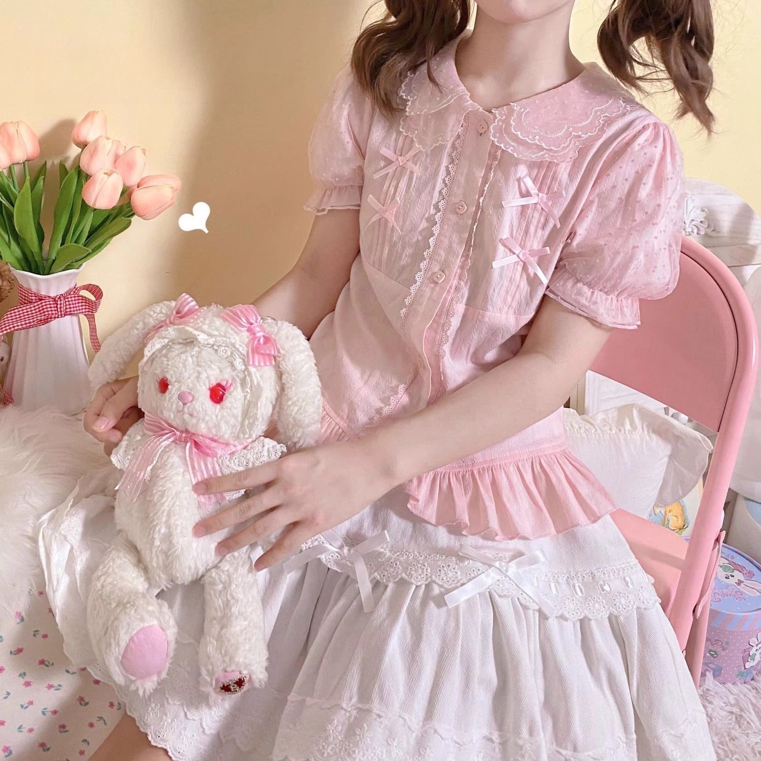 Design Concept:
This sweet Lolita blouse is designed with a short-sleeve cut and adorned with a delicate bow, perfectly capturing a cute and youthful charm. Crafted in white, soft light yellow, and pastel pink, the blouse offers versatile styling options to suit different moods and coordinates. The lightweight fabric ensures comfort while maintaining a refined silhouette, making it an ideal piece to layer under JSKs or pair with Lolita skirts. Whether for daily wear or a tea party, this blouse adds a playfu