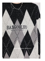 This sweater blends nostalgic charm with modern comfort. The classic fair isle pattern and retro colorblock design evoke a cozy, festive spirit. Crafted from soft, high-quality yarn, its relaxed oversized fit and crewneck offer effortless style and warmth. Perfect for holiday gatherings or casual winter days, it's a versatile piece that adds a touch of timeless, whimsical charm to any seasonal wardrobe, making every moment feel both special and comfortably laid-back.