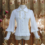 Design Concept:
This collection of Lolita blouses features a slim-fit silhouette with a delicate doll collar and elegant lantern sleeves, combining vintage charm with a refined Lolita aesthetic. The three styles include Pure White, White with Gold Trim, and Black with Gold Trim, offering a range of options from classic elegance to subtly luxurious Gothic-inspired looks.