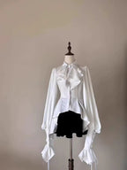 Design Concept:

This Lolita blouse is a charming blend of vintage and medieval aesthetics, designed as a prince-style long-sleeve shirt perfect for layering or cosplay. Crafted in classic white and black, it features meticulous detailing that highlights the timeless elegance of Lolita fashion. The blouse offers a comfortable loose fit while maintaining a structured silhouette, making it ideal for daily wear, themed events, or tea parties. Pair it with skirts or trousers for a refined, versatile look that e