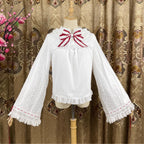 This elegant blouse masterfully blends Victorian romance with subtle Chinese-inspired aesthetics. The dramatic double-layer bishop sleeves and delicate drawstring details create a luxurious, poetic silhouette. Topped with a classic bow tie, it offers a timeless look. Designed for the modern Lolita enthusiast, this undershirt is crafted from premium materials for both comfort and sophistication, making it the perfect foundational piece for creating a statement layered outfit that is both graceful and uniquel