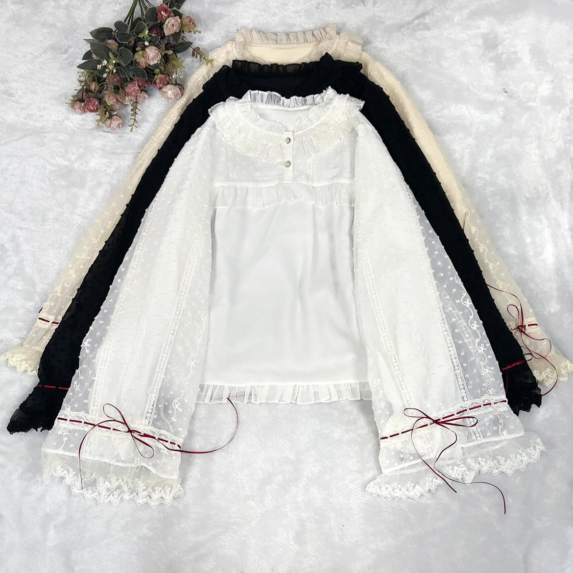 This elegant blouse masterfully blends Victorian romance with subtle Chinese-inspired aesthetics. The dramatic double-layer bishop sleeves and delicate drawstring details create a luxurious, poetic silhouette. Topped with a classic bow tie, it offers a timeless look. Designed for the modern Lolita enthusiast, this undershirt is crafted from premium materials for both comfort and sophistication, making it the perfect foundational piece for creating a statement layered outfit that is both graceful and uniquel