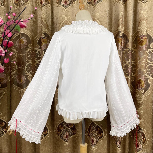 This elegant blouse masterfully blends Victorian romance with subtle Chinese-inspired aesthetics. The dramatic double-layer bishop sleeves and delicate drawstring details create a luxurious, poetic silhouette. Topped with a classic bow tie, it offers a timeless look. Designed for the modern Lolita enthusiast, this undershirt is crafted from premium materials for both comfort and sophistication, making it the perfect foundational piece for creating a statement layered outfit that is both graceful and uniquel