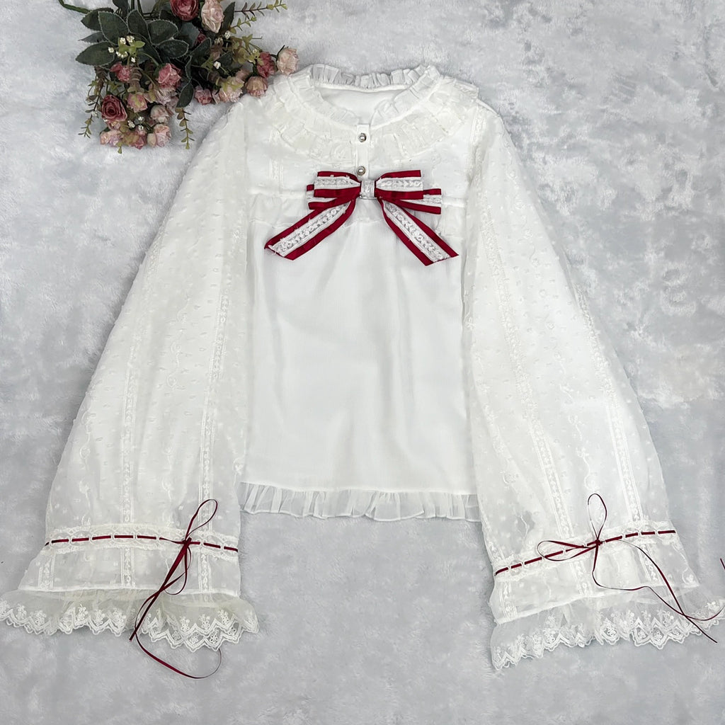 This elegant blouse masterfully blends Victorian romance with subtle Chinese-inspired aesthetics. The dramatic double-layer bishop sleeves and delicate drawstring details create a luxurious, poetic silhouette. Topped with a classic bow tie, it offers a timeless look. Designed for the modern Lolita enthusiast, this undershirt is crafted from premium materials for both comfort and sophistication, making it the perfect foundational piece for creating a statement layered outfit that is both graceful and uniquel