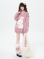 Inspired by the magic of making wishes, this dreamy sweater combines playful bunny motifs with soft romantic details. The adjustable tie-bow neckline and voluminous lantern sleeves create a whimsical silhouette, while the sweet pink and red palette evokes a sense of joyful charm. Lightweight yet cozy, it’s designed to bring a touch of fantasy to everyday wear—for those who believe in sweetness, magic, and self-expression.