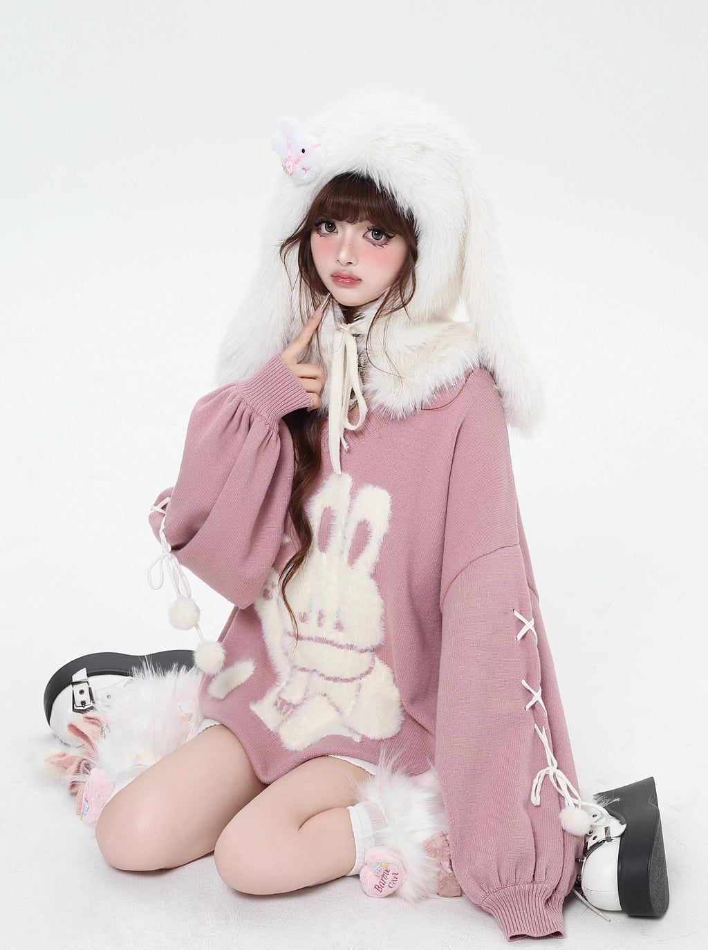Inspired by the magic of making wishes, this dreamy sweater combines playful bunny motifs with soft romantic details. The adjustable tie-bow neckline and voluminous lantern sleeves create a whimsical silhouette, while the sweet pink and red palette evokes a sense of joyful charm. Lightweight yet cozy, it’s designed to bring a touch of fantasy to everyday wear—for those who believe in sweetness, magic, and self-expression.