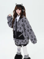 Inspired by the playful warmth of a kitten, this cozy set features a plush sherpa jacket with adorable paw prints, a matching hood, and a versatile scarf. The soft gray and apricot hues evoke a gentle winter charm. Designed for ultimate comfort and whimsical style, it’s perfect for cold days spent curled up or exploring. Embrace a touch of feline-inspired fun!