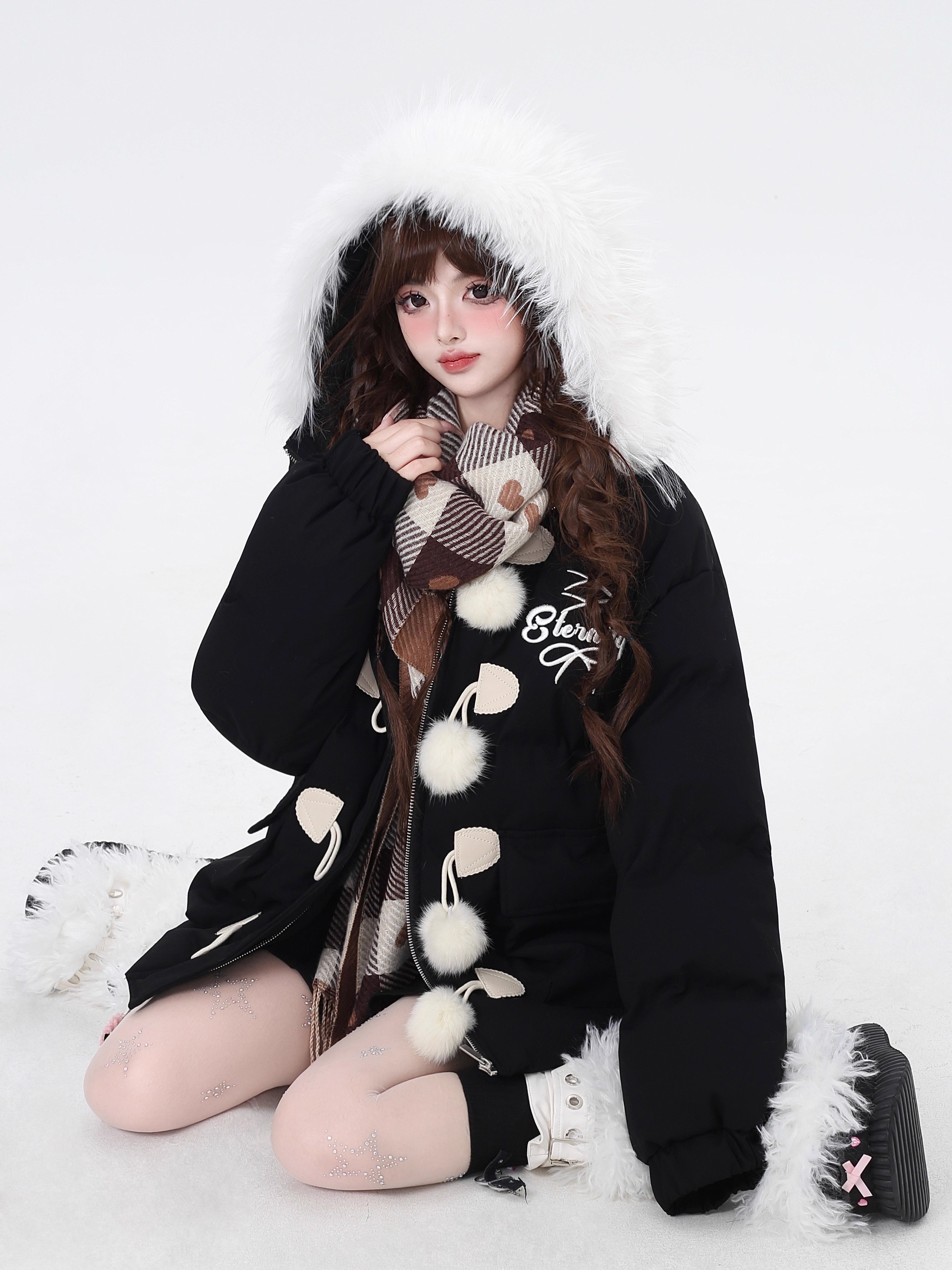 Designed for ultimate cozy charm, this oversized parka combines a soft fleece interior and a luxurious fur-trimmed hood for warmth and style. The sweet yet modern apricot and black palette complements any winter outfit. Perfect for staying snug while looking effortlessly cute on cold days. Embrace comfort with a touch of playful elegance.