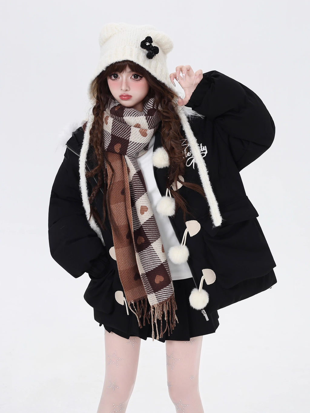 Designed for ultimate cozy charm, this oversized parka combines a soft fleece interior and a luxurious fur-trimmed hood for warmth and style. The sweet yet modern apricot and black palette complements any winter outfit. Perfect for staying snug while looking effortlessly cute on cold days. Embrace comfort with a touch of playful elegance.