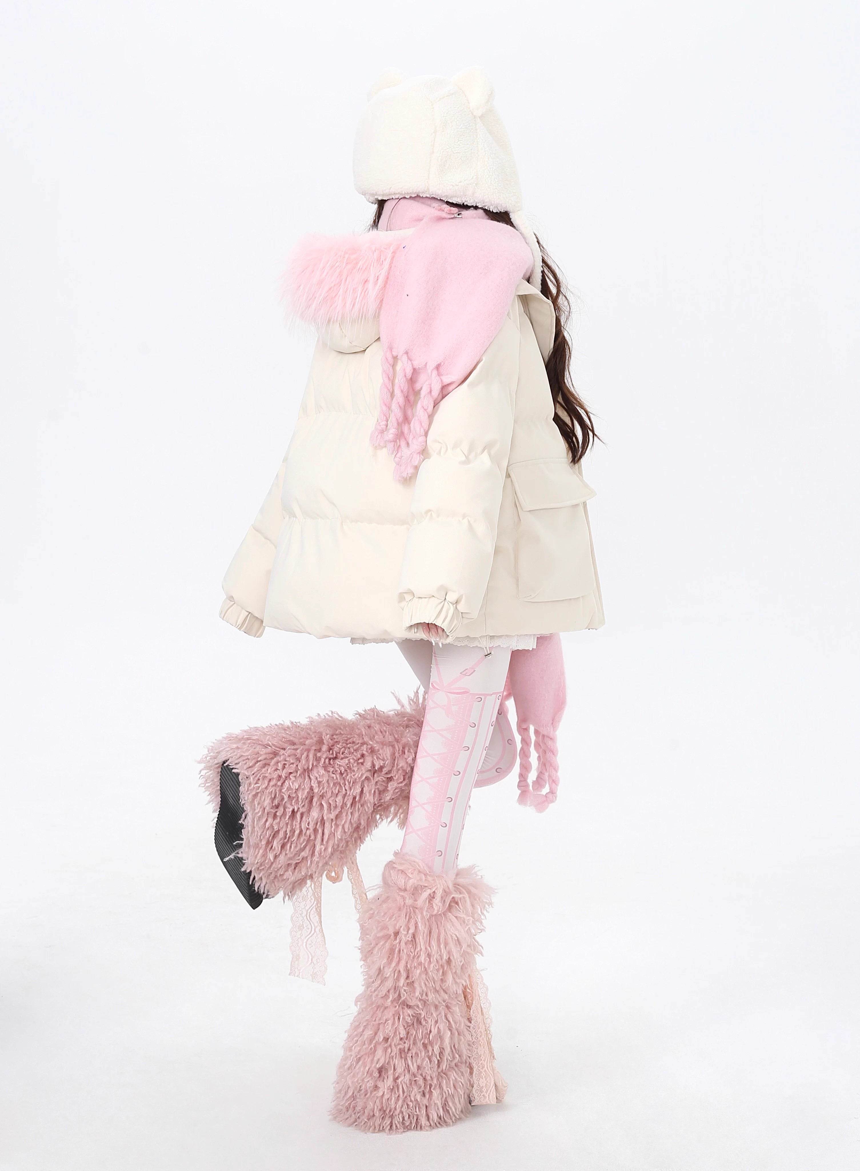 Designed for ultimate cozy charm, this oversized parka combines a soft fleece interior and a luxurious fur-trimmed hood for warmth and style. The sweet yet modern apricot and black palette complements any winter outfit. Perfect for staying snug while looking effortlessly cute on cold days. Embrace comfort with a touch of playful elegance.