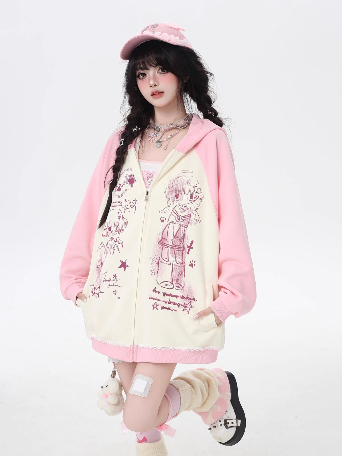 This Lolita Coats Japanese-inspired hoodie combines playful manga print elements with a soft color-block design in black, white, pink, and apricot. Crafted for a relaxed, loose fit, it offers casual comfort while adding a touch of Y2K and Japanese streetwear charm to your autumn wardrobe. Perfect for daily wear, the lightweight fabric ensures ease of movement, and the cozy hood adds both style and practicality. This versatile piece effortlessly blends cute, edgy, and casual aesthetics for a standout seasona
