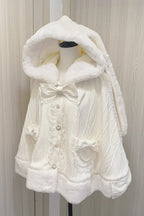 Blending whimsy with elegance, this cape coat transforms classic Lolita charm into a versatile outerwear piece. The playful rabbit ears and delicate bow contrast the monochrome palette, creating a striking balance between sweetness and sophistication. Designed with a flowing silhouette and single-row button closure, it offers effortless layering for cool days—perfect for adding a touch of fantasy to both casual and formal Lolita coordinates.