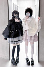 Blending whimsy with elegance, this cape coat transforms classic Lolita charm into a versatile outerwear piece. The playful rabbit ears and delicate bow contrast the monochrome palette, creating a striking balance between sweetness and sophistication. Designed with a flowing silhouette and single-row button closure, it offers effortless layering for cool days—perfect for adding a touch of fantasy to both casual and formal Lolita coordinates.