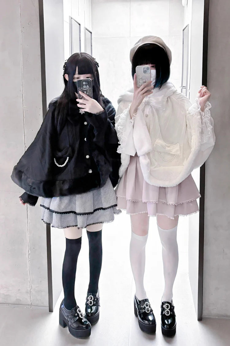 Blending whimsy with elegance, this cape coat transforms classic Lolita charm into a versatile outerwear piece. The playful rabbit ears and delicate bow contrast the monochrome palette, creating a striking balance between sweetness and sophistication. Designed with a flowing silhouette and single-row button closure, it offers effortless layering for cool days—perfect for adding a touch of fantasy to both casual and formal Lolita coordinates.