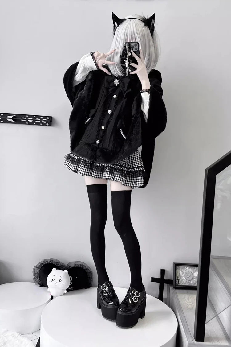 Blending whimsy with elegance, this cape coat transforms classic Lolita charm into a versatile outerwear piece. The playful rabbit ears and delicate bow contrast the monochrome palette, creating a striking balance between sweetness and sophistication. Designed with a flowing silhouette and single-row button closure, it offers effortless layering for cool days—perfect for adding a touch of fantasy to both casual and formal Lolita coordinates.