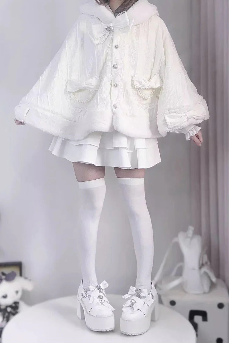 Blending whimsy with elegance, this cape coat transforms classic Lolita charm into a versatile outerwear piece. The playful rabbit ears and delicate bow contrast the monochrome palette, creating a striking balance between sweetness and sophistication. Designed with a flowing silhouette and single-row button closure, it offers effortless layering for cool days—perfect for adding a touch of fantasy to both casual and formal Lolita coordinates.