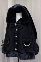 Blending whimsy with elegance, this cape coat transforms classic Lolita charm into a versatile outerwear piece. The playful rabbit ears and delicate bow contrast the monochrome palette, creating a striking balance between sweetness and sophistication. Designed with a flowing silhouette and single-row button closure, it offers effortless layering for cool days—perfect for adding a touch of fantasy to both casual and formal Lolita coordinates.
