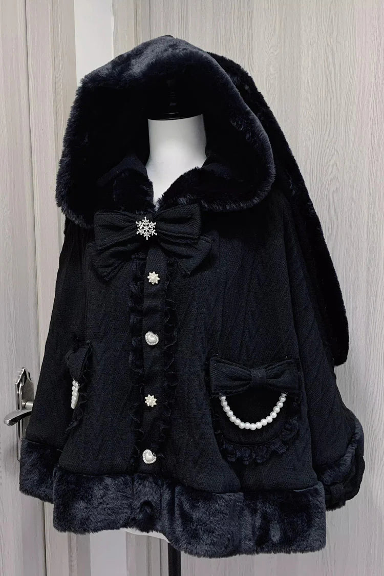 Blending whimsy with elegance, this cape coat transforms classic Lolita charm into a versatile outerwear piece. The playful rabbit ears and delicate bow contrast the monochrome palette, creating a striking balance between sweetness and sophistication. Designed with a flowing silhouette and single-row button closure, it offers effortless layering for cool days—perfect for adding a touch of fantasy to both casual and formal Lolita coordinates.
