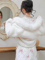 Inspired by the ethereal texture of cloud mousse, this wrap embodies luxurious comfort. Crafted from incredibly soft, plush faux mink fur, it offers a guilt-free, vegan-friendly opulence. The pure white hue and elegant shawl collar design evoke timeless French elegance. Lightweight yet cozy, it's the perfect statement piece for effortless style and sublime warmth, blending ethical fashion with a touch of romantic sophistication.