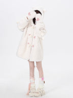 Inspired by the playful charm of a kitten, this ultra-plush sherpa jacket features adorable cat ears on the hood and an oversized cozy fit. The creamy white hue adds a touch of sweetness, while the thick lining ensures warmth without sacrificing style. Perfect for expressing a soft, whimsical aesthetic during cold days.