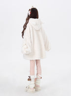 Inspired by the playful charm of a kitten, this ultra-plush sherpa jacket features adorable cat ears on the hood and an oversized cozy fit. The creamy white hue adds a touch of sweetness, while the thick lining ensures warmth without sacrificing style. Perfect for expressing a soft, whimsical aesthetic during cold days.