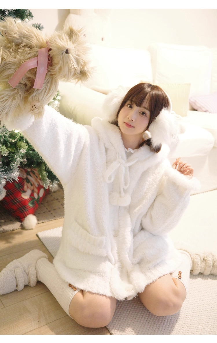 Inspired by frost-kissed mornings and playful sweetness, this hooded cardigan combines fluffy pom-pom details with a cozy oversized silhouette. The soft blue and white blend evokes a winter fairy tale, while the thick knit ensures warmth without weight. Perfect for lazy weekends or casual outings, it wraps you in a dreamy blend of innocence and comfort—like a hug from the snow itself.