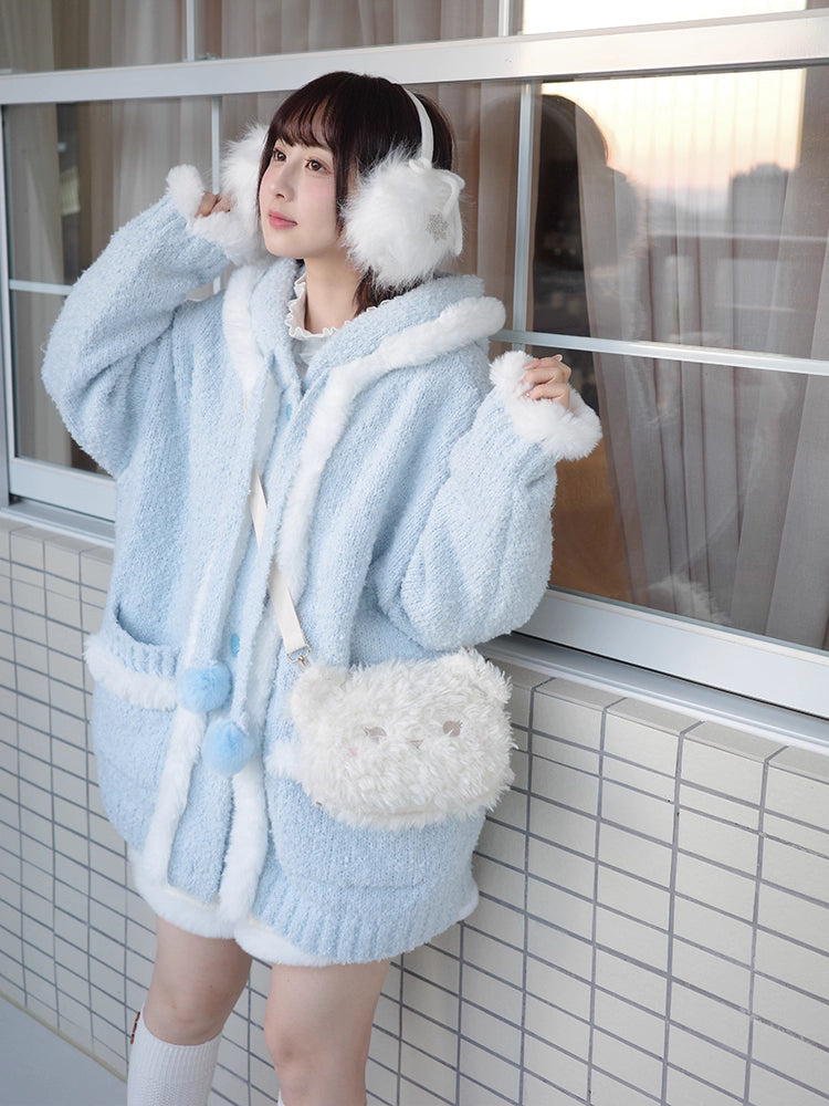 Inspired by frost-kissed mornings and playful sweetness, this hooded cardigan combines fluffy pom-pom details with a cozy oversized silhouette. The soft blue and white blend evokes a winter fairy tale, while the thick knit ensures warmth without weight. Perfect for lazy weekends or casual outings, it wraps you in a dreamy blend of innocence and comfort—like a hug from the snow itself.