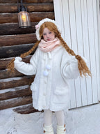 Inspired by frost-kissed mornings and playful sweetness, this hooded cardigan combines fluffy pom-pom details with a cozy oversized silhouette. The soft blue and white blend evokes a winter fairy tale, while the thick knit ensures warmth without weight. Perfect for lazy weekends or casual outings, it wraps you in a dreamy blend of innocence and comfort—like a hug from the snow itself.