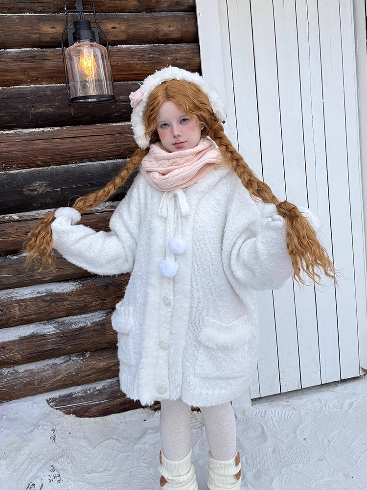 Inspired by frost-kissed mornings and playful sweetness, this hooded cardigan combines fluffy pom-pom details with a cozy oversized silhouette. The soft blue and white blend evokes a winter fairy tale, while the thick knit ensures warmth without weight. Perfect for lazy weekends or casual outings, it wraps you in a dreamy blend of innocence and comfort—like a hug from the snow itself.