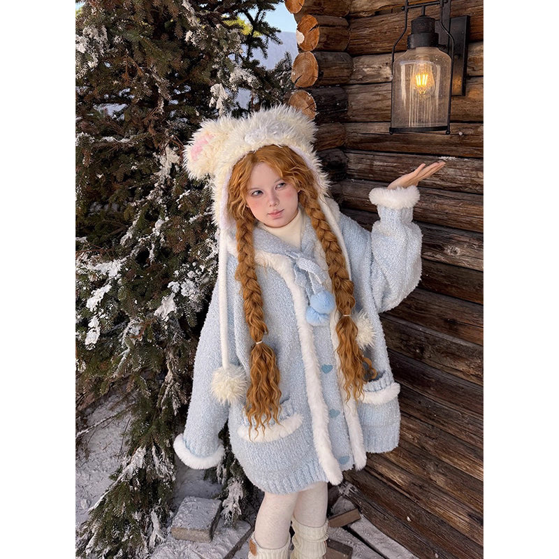 Inspired by frost-kissed mornings and playful sweetness, this hooded cardigan combines fluffy pom-pom details with a cozy oversized silhouette. The soft blue and white blend evokes a winter fairy tale, while the thick knit ensures warmth without weight. Perfect for lazy weekends or casual outings, it wraps you in a dreamy blend of innocence and comfort—like a hug from the snow itself.