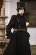 Inspired by the silent majesty of winter woods, this coat combines sharp tailoring with organic elegance. The sleek black wool blend contours the silhouette with minimalist precision, while architectural lines and a mid-length cut evoke modern resilience. Functional details like deep pockets and a structured collar blend practicality with poetic cold-weather sophistication—for those who command the urban landscape with serene strength.