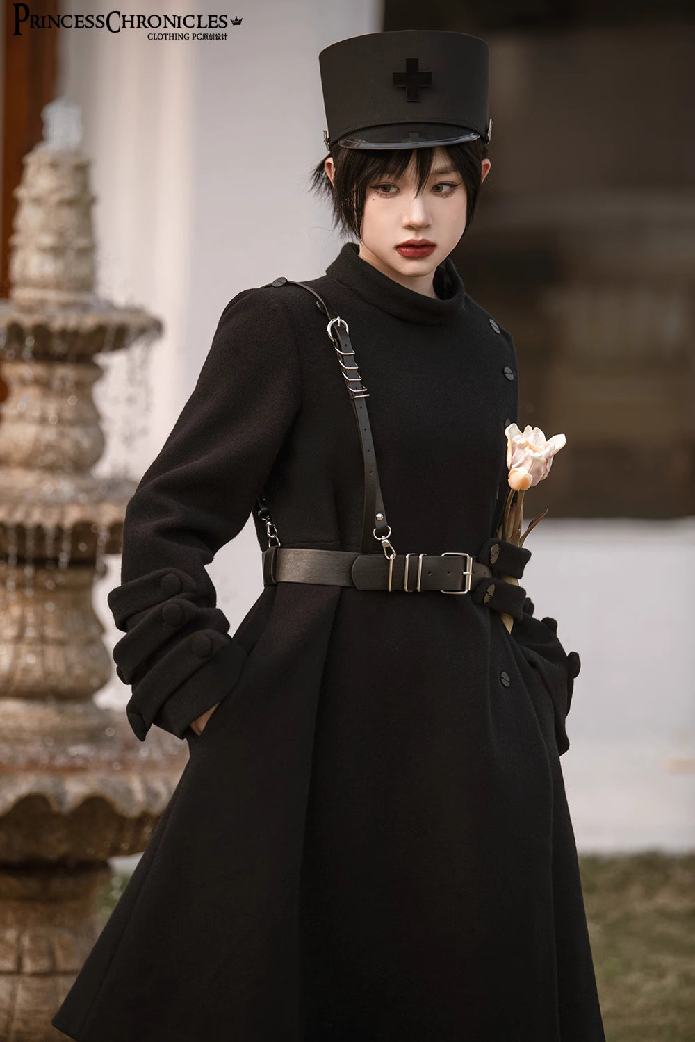 Inspired by the silent majesty of winter woods, this coat combines sharp tailoring with organic elegance. The sleek black wool blend contours the silhouette with minimalist precision, while architectural lines and a mid-length cut evoke modern resilience. Functional details like deep pockets and a structured collar blend practicality with poetic cold-weather sophistication—for those who command the urban landscape with serene strength.