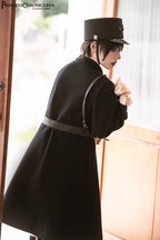 Inspired by the silent majesty of winter woods, this coat combines sharp tailoring with organic elegance. The sleek black wool blend contours the silhouette with minimalist precision, while architectural lines and a mid-length cut evoke modern resilience. Functional details like deep pockets and a structured collar blend practicality with poetic cold-weather sophistication—for those who command the urban landscape with serene strength.
