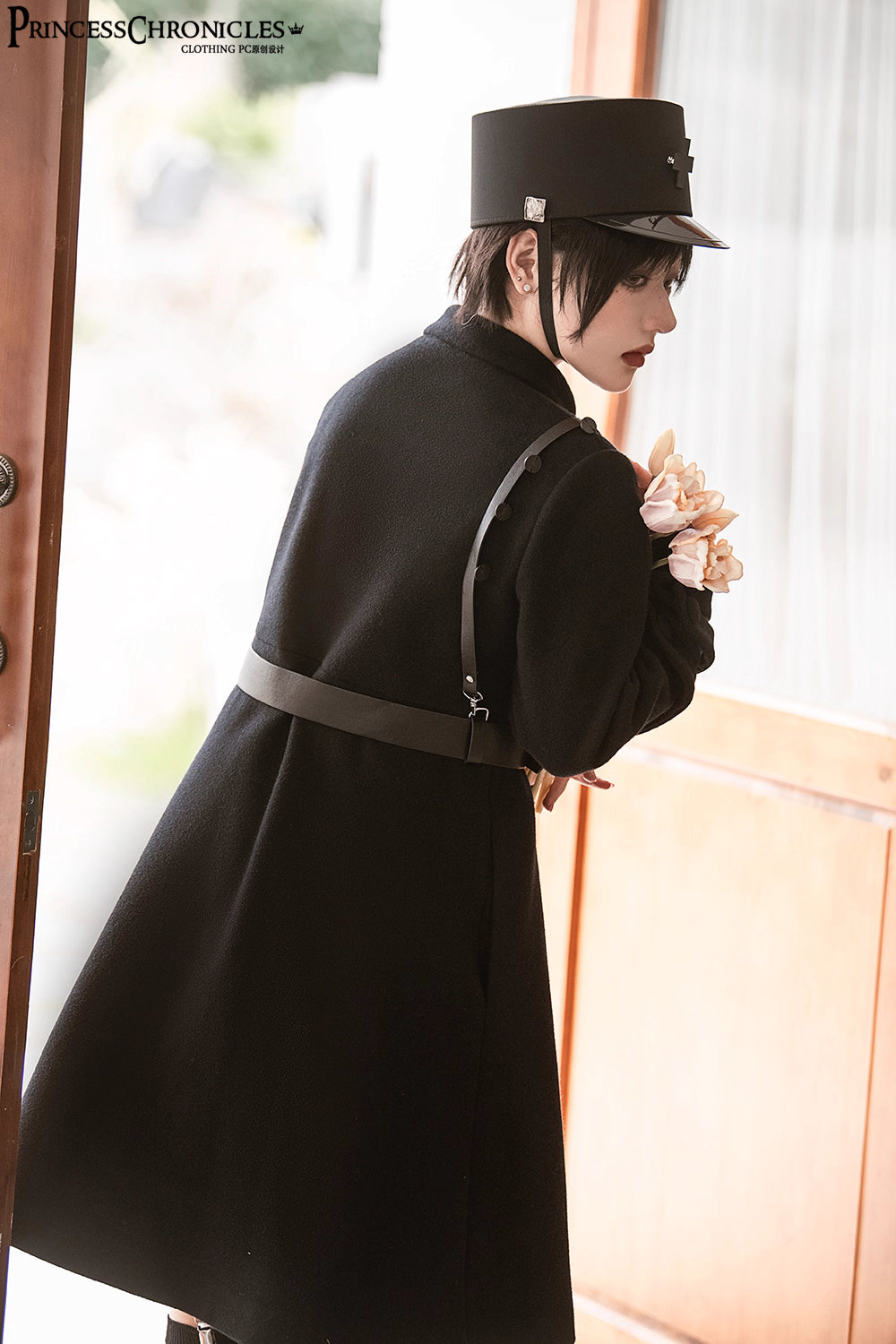 Inspired by the silent majesty of winter woods, this coat combines sharp tailoring with organic elegance. The sleek black wool blend contours the silhouette with minimalist precision, while architectural lines and a mid-length cut evoke modern resilience. Functional details like deep pockets and a structured collar blend practicality with poetic cold-weather sophistication—for those who command the urban landscape with serene strength.