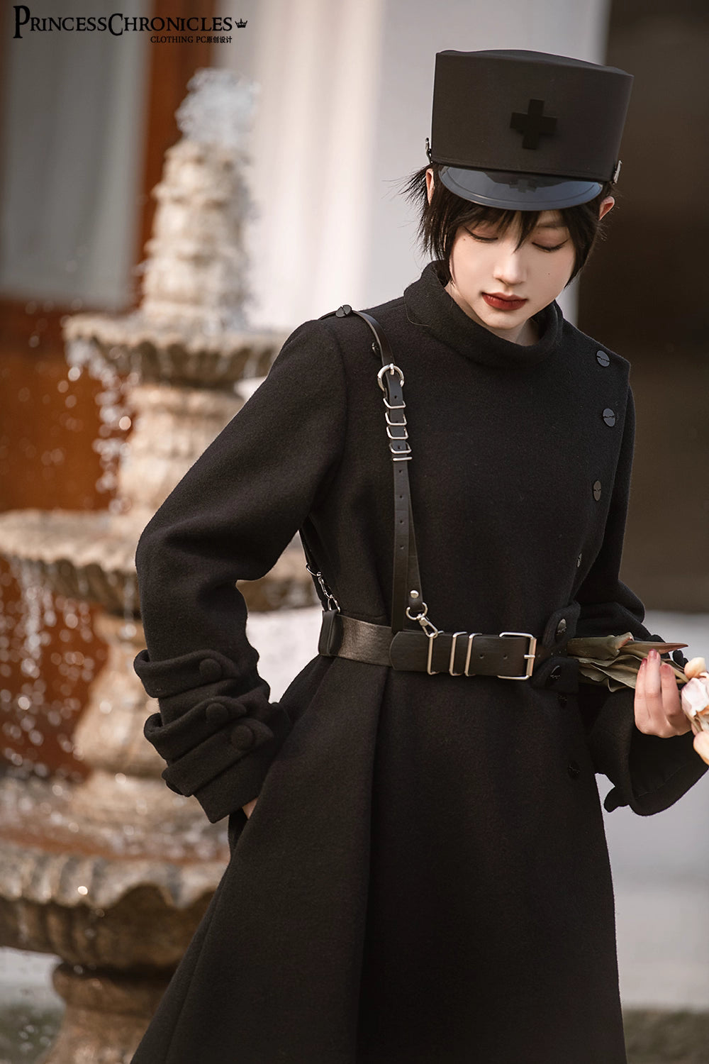 Inspired by the silent majesty of winter woods, this coat combines sharp tailoring with organic elegance. The sleek black wool blend contours the silhouette with minimalist precision, while architectural lines and a mid-length cut evoke modern resilience. Functional details like deep pockets and a structured collar blend practicality with poetic cold-weather sophistication—for those who command the urban landscape with serene strength.