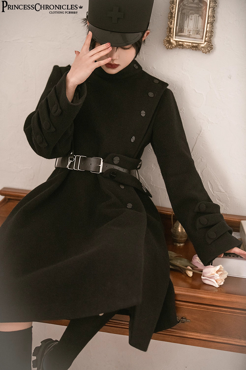 Inspired by the silent majesty of winter woods, this coat combines sharp tailoring with organic elegance. The sleek black wool blend contours the silhouette with minimalist precision, while architectural lines and a mid-length cut evoke modern resilience. Functional details like deep pockets and a structured collar blend practicality with poetic cold-weather sophistication—for those who command the urban landscape with serene strength.