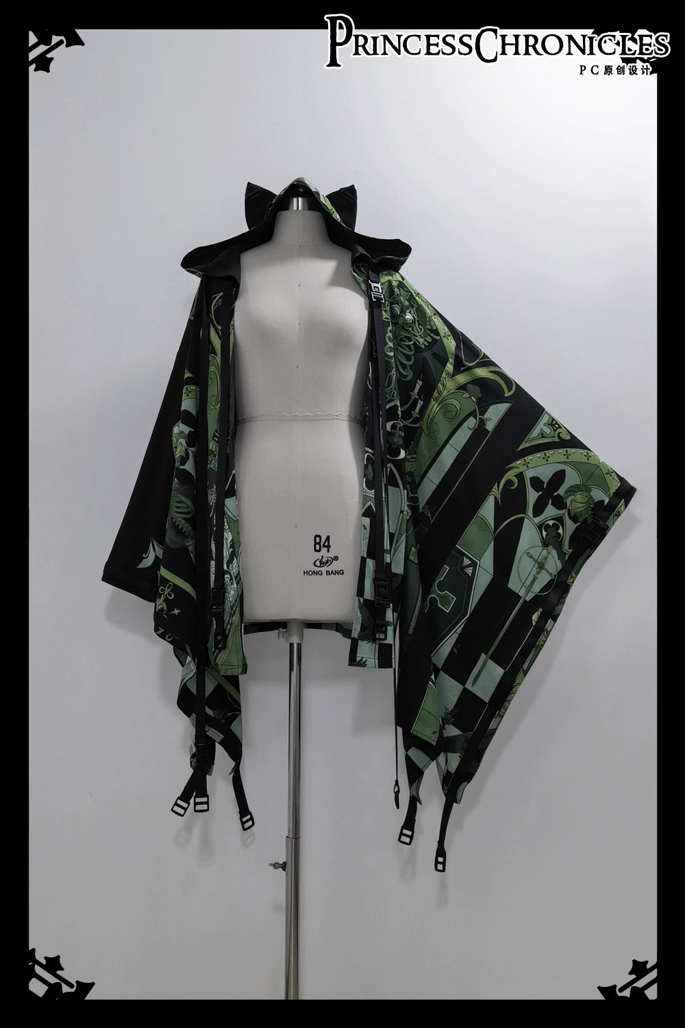 This coat merges Lolita’s classic silhouette with cyberpunk’s dystopian edge. Structured shoulders and a tailored waist contrast with tactical harness details and glitch-art graphic prints. Crafted from heavy-duty wool blend, it features metallic hardware and neon accent stitching, blending Victorian elegance with futuristic rebellion. Designed for commanding presence in both digital and urban landscapes, it embodies a fusion of dark romance and tech-driven defiance.