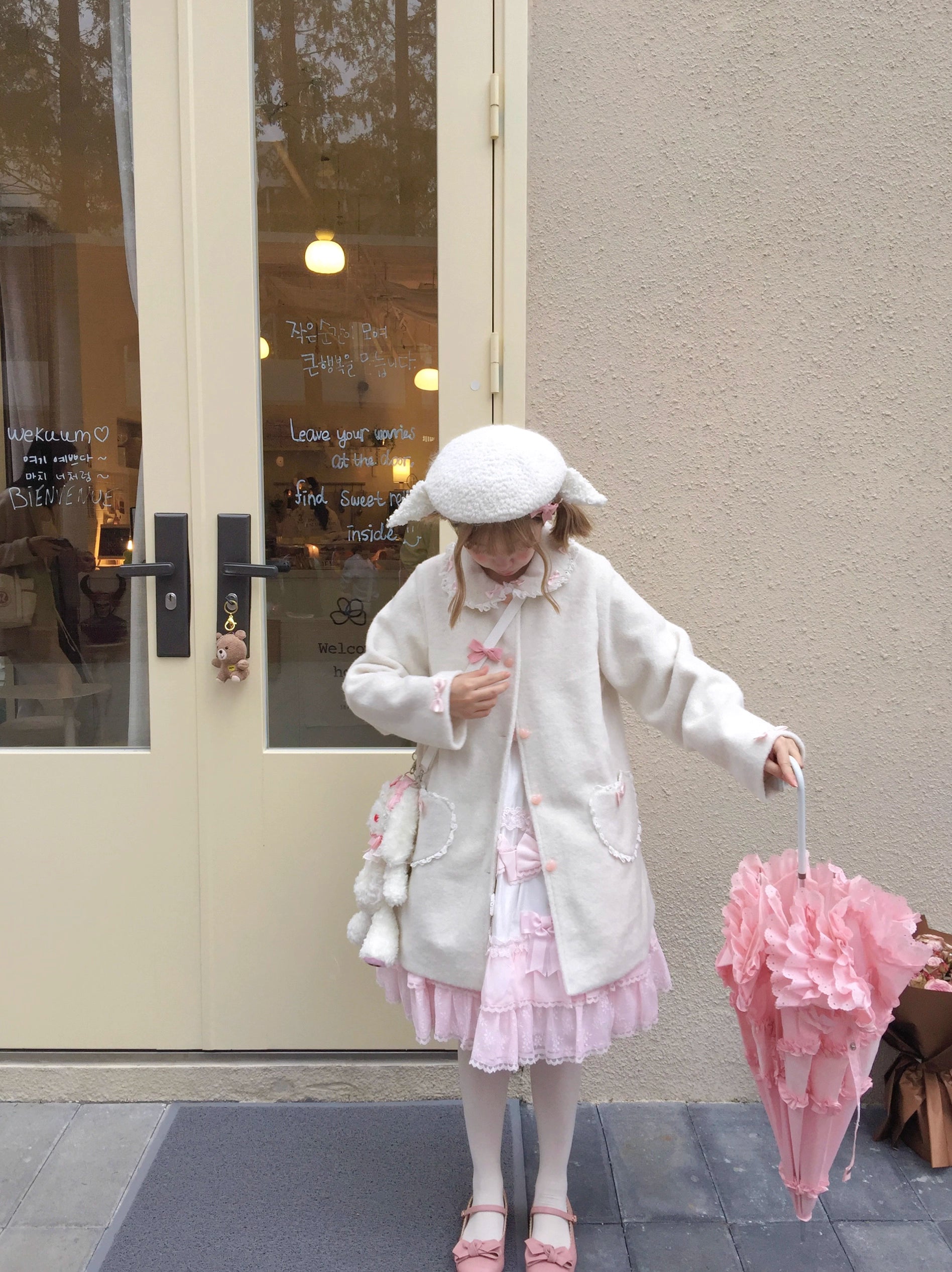 The Pink and White Vintage Lolita Winter Coat is designed to bring warmth and sweetness to the cold season. Crafted with a soft, cozy texture, it features delicate bow accents and a retro-inspired silhouette that highlights a girlish charm. The pastel pink and white tones add a dreamy, cute touch, perfect for creating a fairytale-like winter look. Both stylish and practical, this coat embodies the essence of sweet Lolita elegance and coziness.