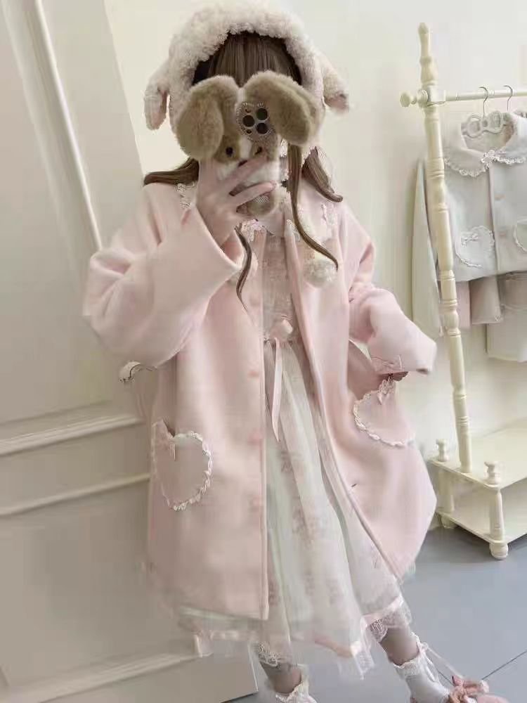 The Pink and White Vintage Lolita Winter Coat is designed to bring warmth and sweetness to the cold season. Crafted with a soft, cozy texture, it features delicate bow accents and a retro-inspired silhouette that highlights a girlish charm. The pastel pink and white tones add a dreamy, cute touch, perfect for creating a fairytale-like winter look. Both stylish and practical, this coat embodies the essence of sweet Lolita elegance and coziness.