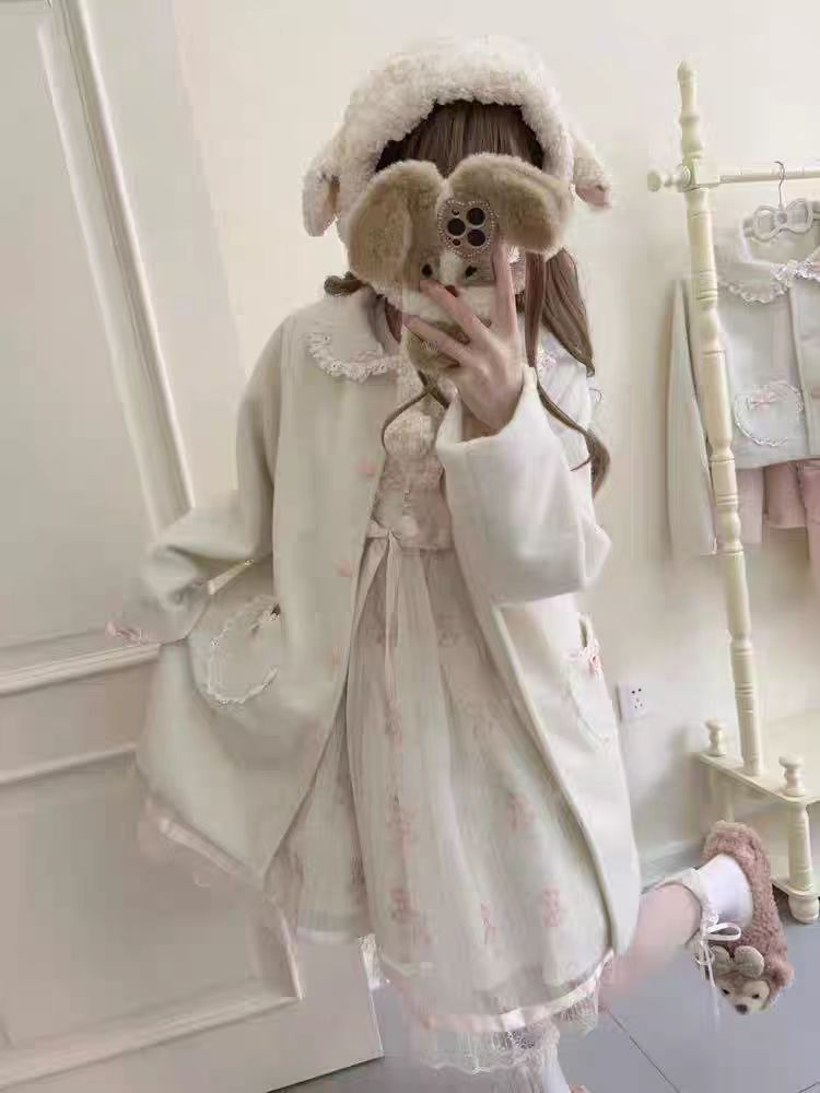 The Pink and White Vintage Lolita Winter Coat is designed to bring warmth and sweetness to the cold season. Crafted with a soft, cozy texture, it features delicate bow accents and a retro-inspired silhouette that highlights a girlish charm. The pastel pink and white tones add a dreamy, cute touch, perfect for creating a fairytale-like winter look. Both stylish and practical, this coat embodies the essence of sweet Lolita elegance and coziness.