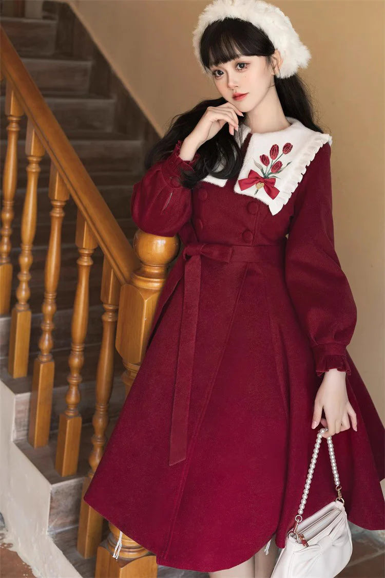 "Blooming in Frost"&nbsp;— Inspired by the bold beauty of tulips piercing through winter soil, this coat dress symbolizes resilience and romance. The vibrant crimson hue echoes the flower’s velvety petals, while intricate embroidery captures the delicate curvature of stems and leaves, merging botanical artistry with Lolita elegance.