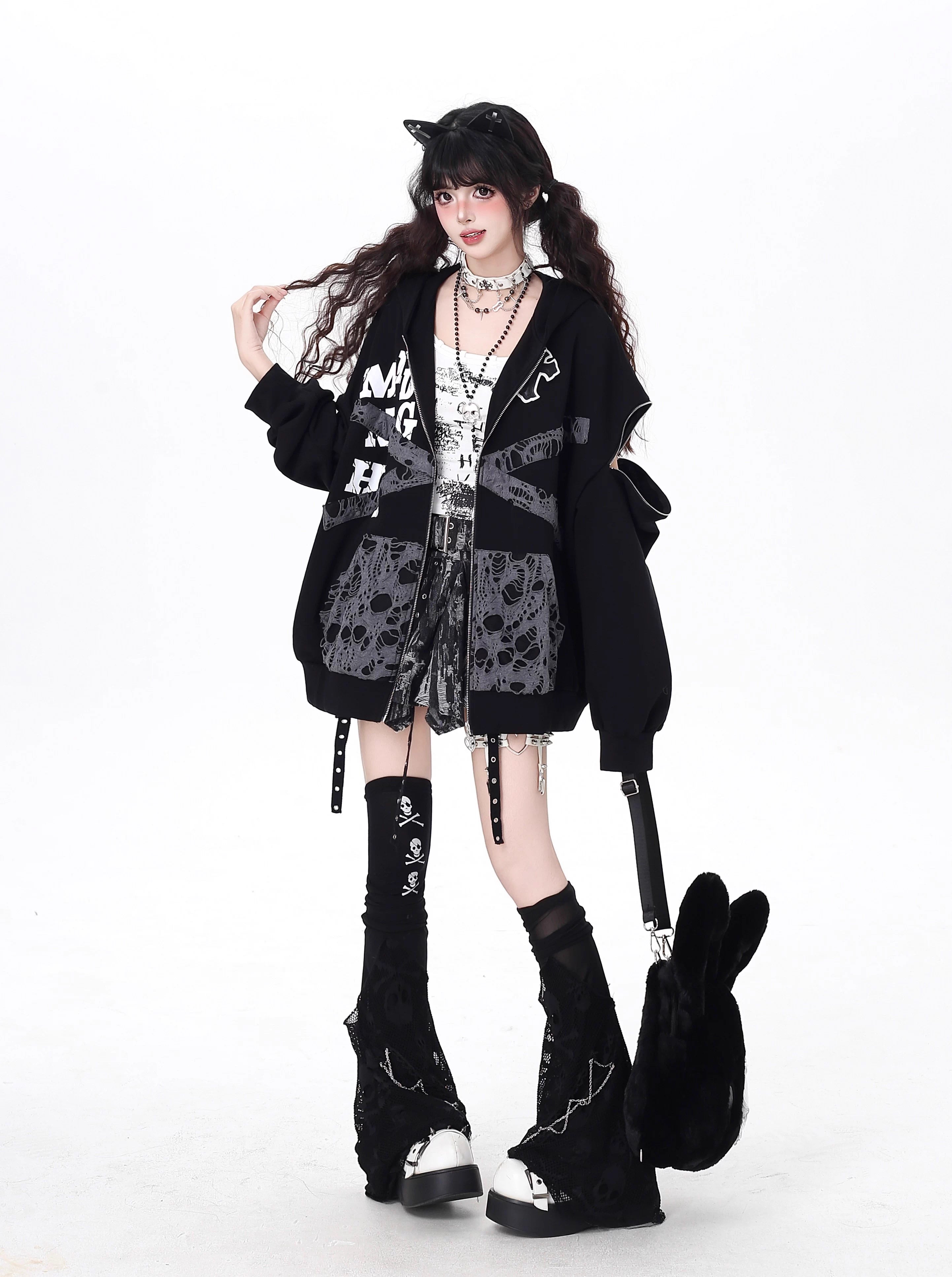 Raw-edged and rebellious, this hoodie features a distressed破洞 design and an original kitten graphic, channeling underground alt youth culture. The oversized fit and muted grey-black palette keep it effortlessly cool, while soft brushed fleece offers cozy comfort. For those who wear their attitude on their sleeve—literally.