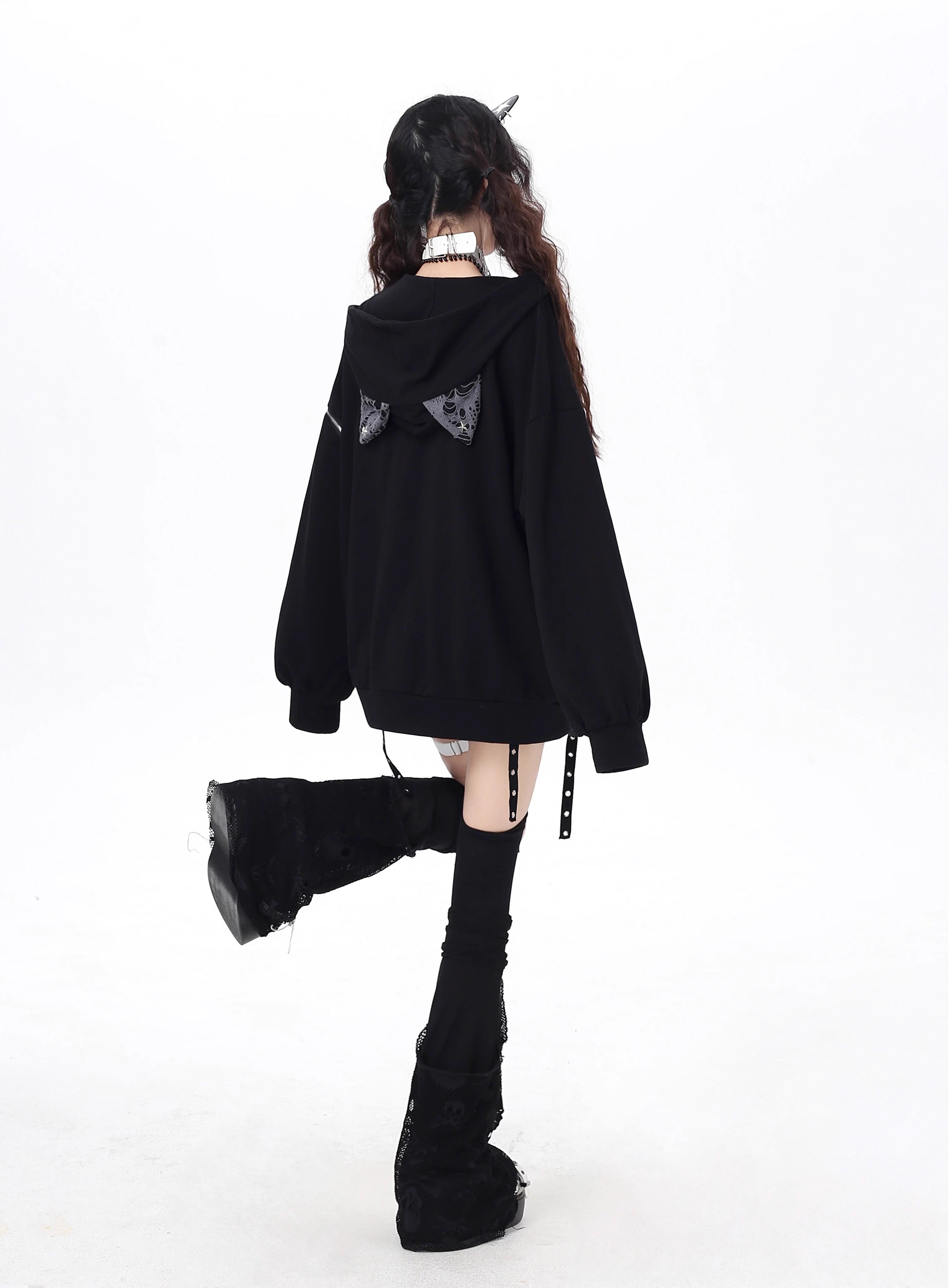 Raw-edged and rebellious, this hoodie features a distressed破洞 design and an original kitten graphic, channeling underground alt youth culture. The oversized fit and muted grey-black palette keep it effortlessly cool, while soft brushed fleece offers cozy comfort. For those who wear their attitude on their sleeve—literally.