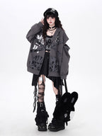 Raw-edged and rebellious, this hoodie features a distressed破洞 design and an original kitten graphic, channeling underground alt youth culture. The oversized fit and muted grey-black palette keep it effortlessly cool, while soft brushed fleece offers cozy comfort. For those who wear their attitude on their sleeve—literally.