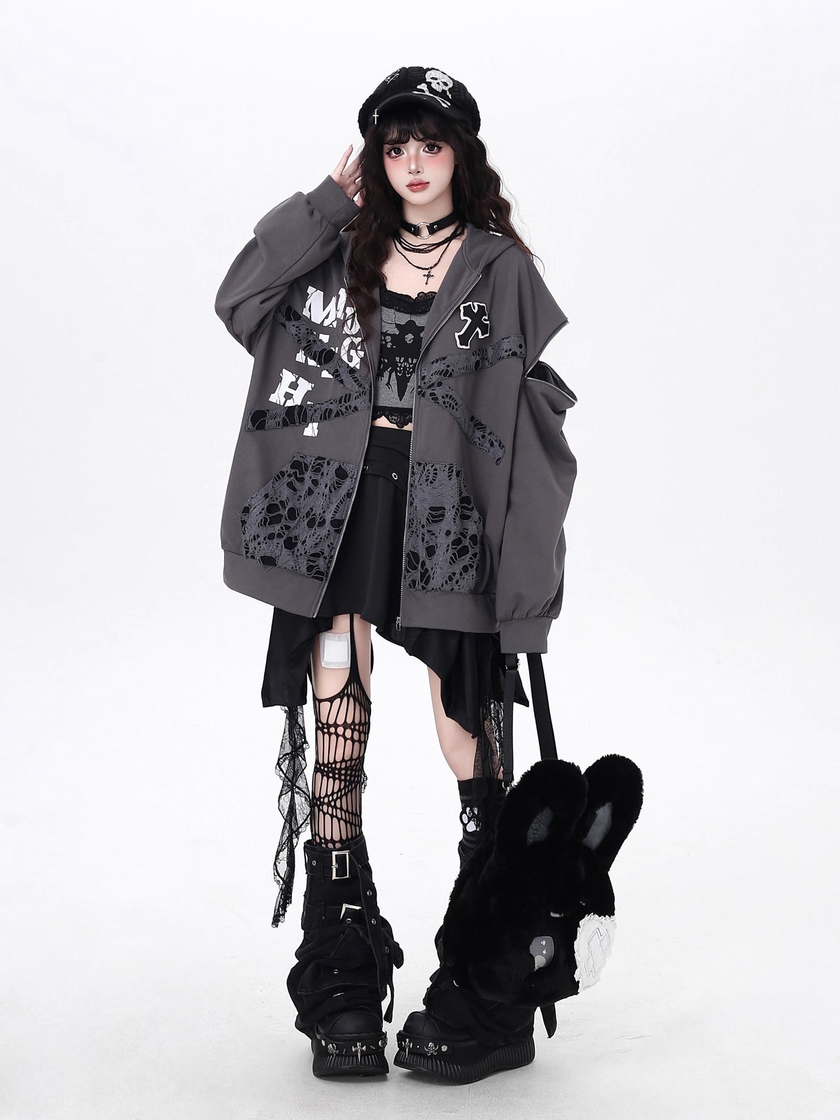 Raw-edged and rebellious, this hoodie features a distressed破洞 design and an original kitten graphic, channeling underground alt youth culture. The oversized fit and muted grey-black palette keep it effortlessly cool, while soft brushed fleece offers cozy comfort. For those who wear their attitude on their sleeve—literally.