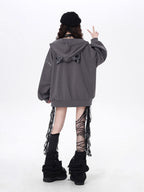 Raw-edged and rebellious, this hoodie features a distressed破洞 design and an original kitten graphic, channeling underground alt youth culture. The oversized fit and muted grey-black palette keep it effortlessly cool, while soft brushed fleece offers cozy comfort. For those who wear their attitude on their sleeve—literally.