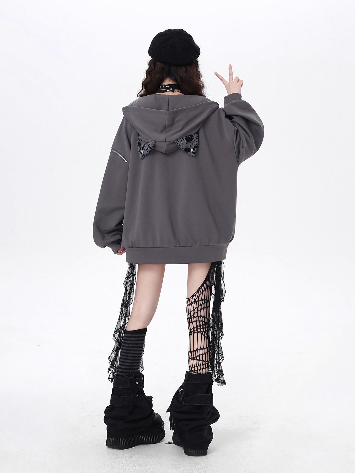 Raw-edged and rebellious, this hoodie features a distressed破洞 design and an original kitten graphic, channeling underground alt youth culture. The oversized fit and muted grey-black palette keep it effortlessly cool, while soft brushed fleece offers cozy comfort. For those who wear their attitude on their sleeve—literally.
