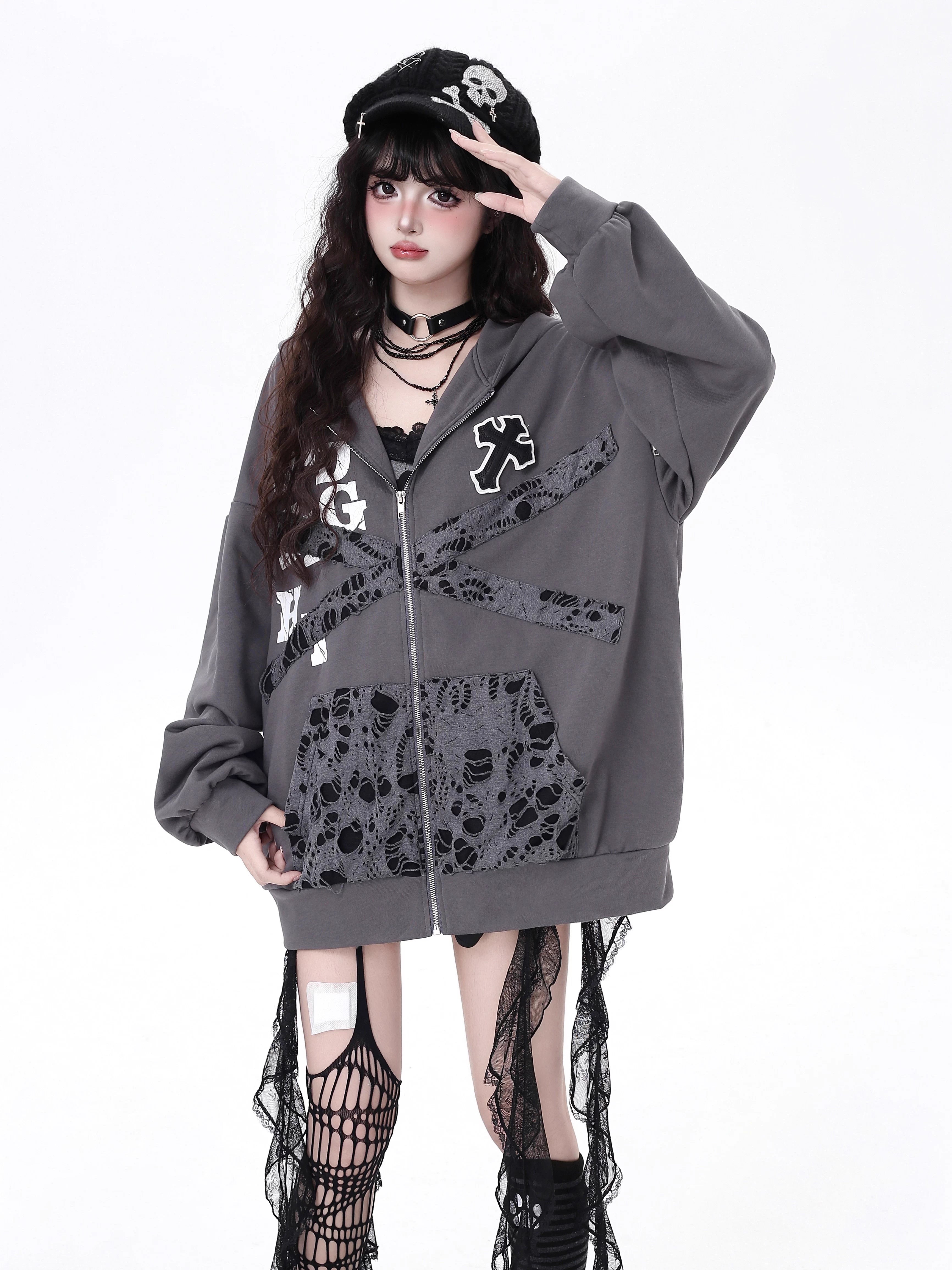 Raw-edged and rebellious, this hoodie features a distressed破洞 design and an original kitten graphic, channeling underground alt youth culture. The oversized fit and muted grey-black palette keep it effortlessly cool, while soft brushed fleece offers cozy comfort. For those who wear their attitude on their sleeve—literally.